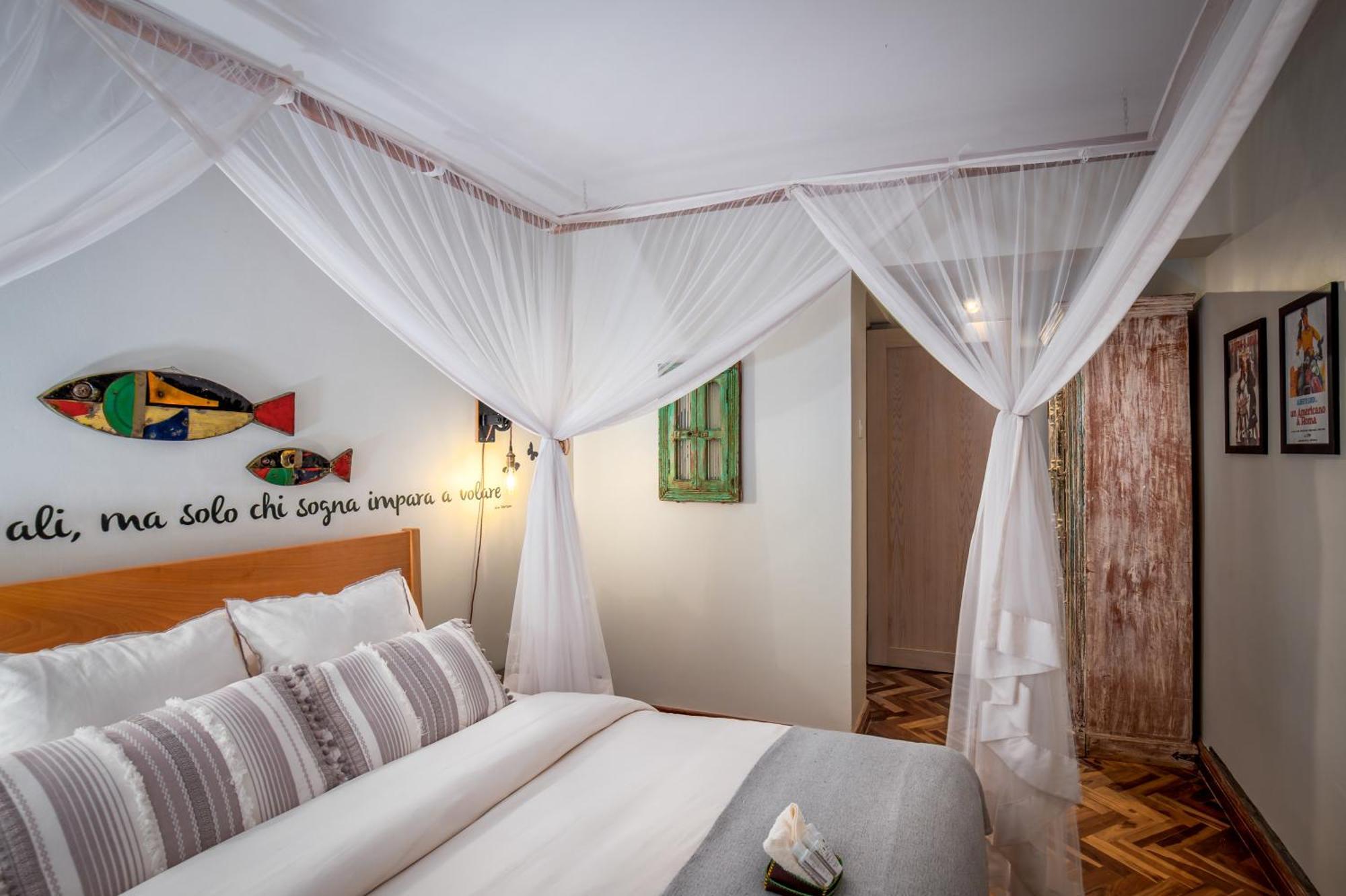 Ewange - A Casa Mia Panzió Kampala Szoba fotó